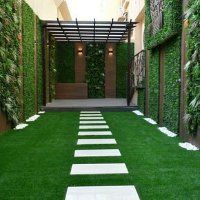 Outdoor Seating Area with Artificial Grass Flooring & Hedge Tile Wall Panels Featuring Trace Design