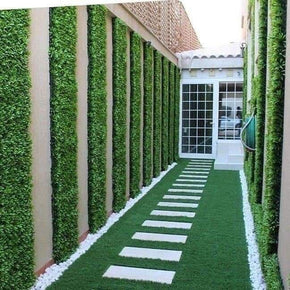 Artificial Grass Flooring with Hedge Tile Wall Panels Featuring Corridor Design